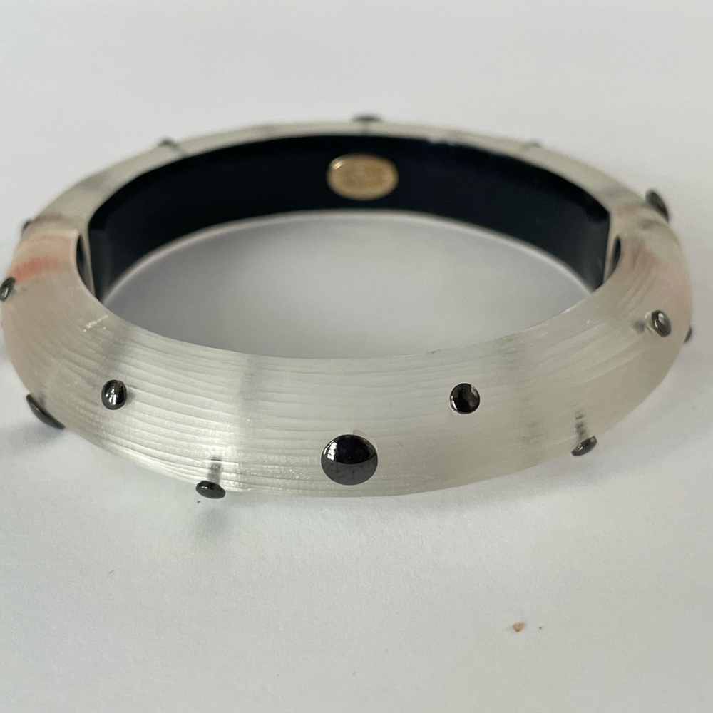 Alexis Bittar Frosted White Hinged Bangle Bracelet with metallic black dots